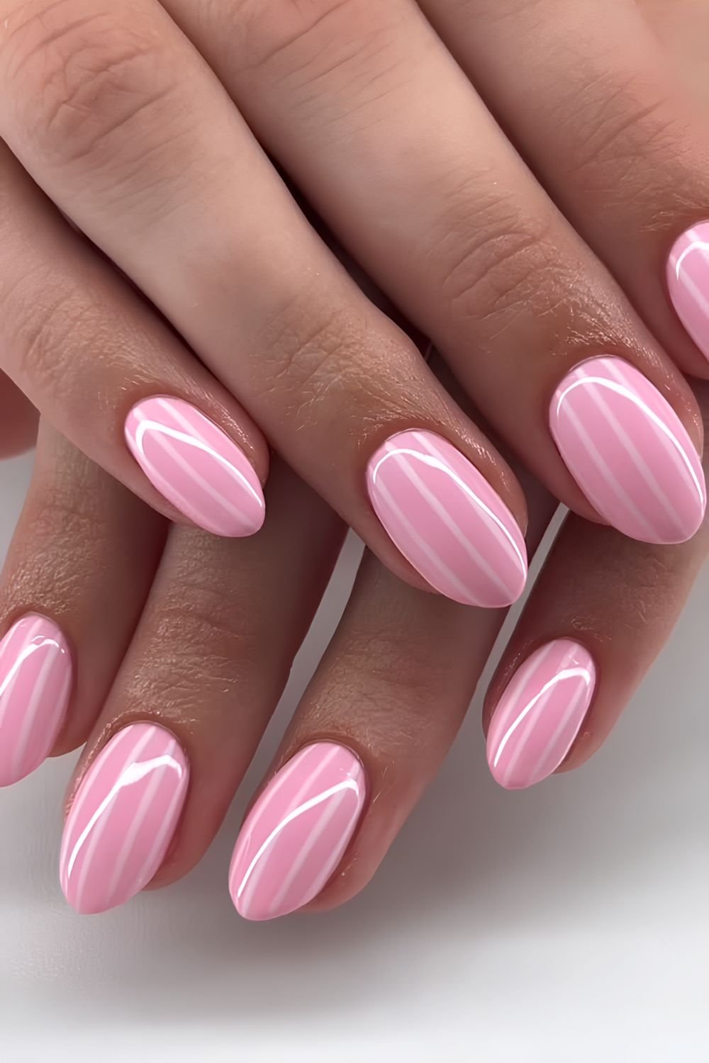 Striped pink and white manicure