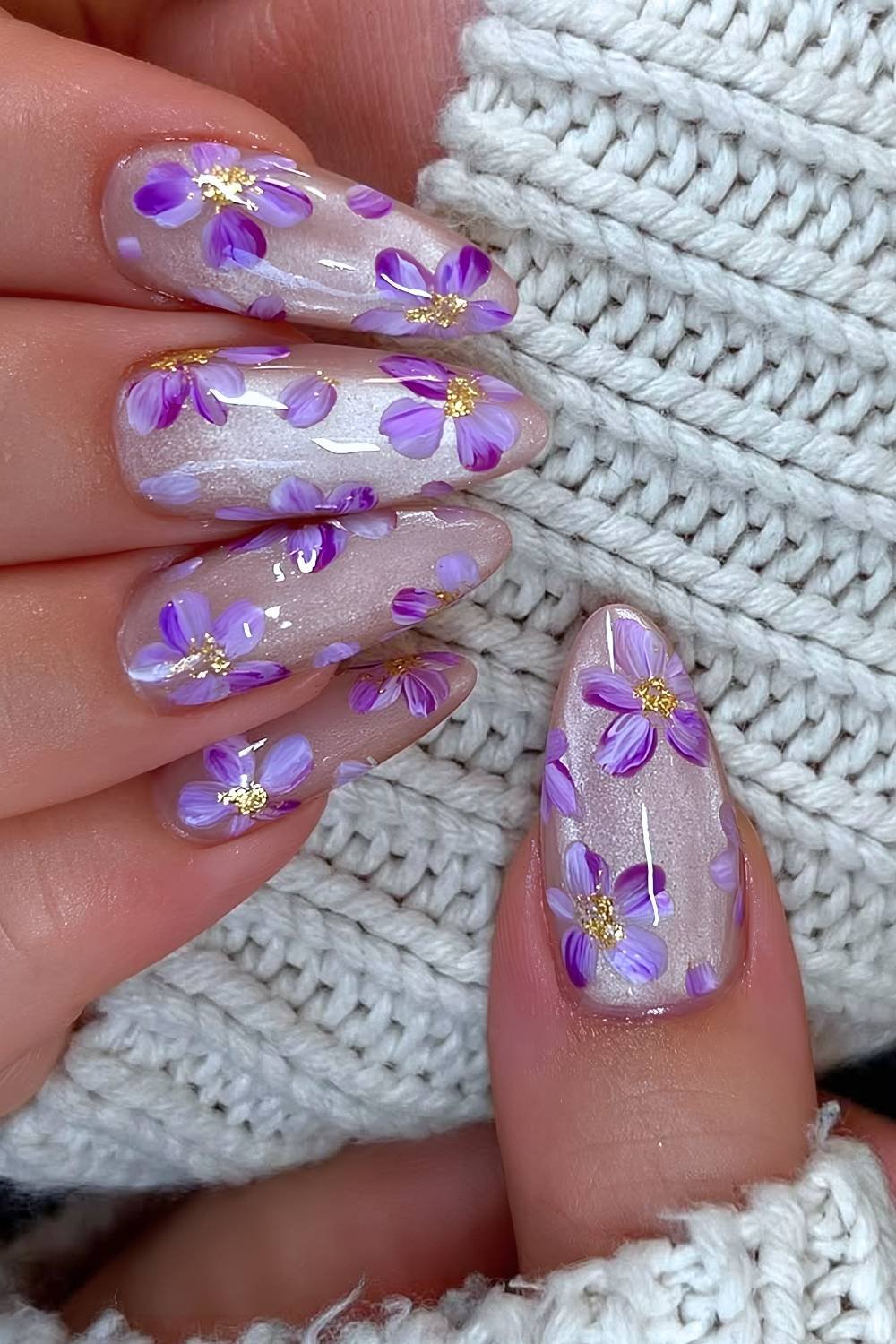 White cat eye nails with purple flower design