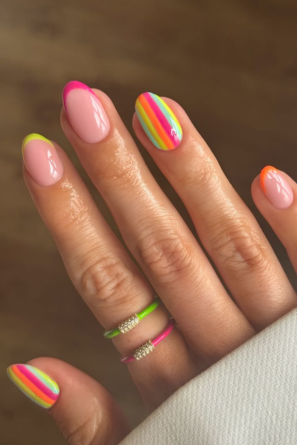 Colorful striped nails with French tip accents
