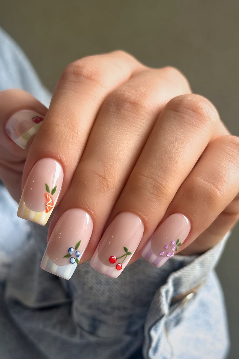 Multicolored striped French nails wit fruit accents