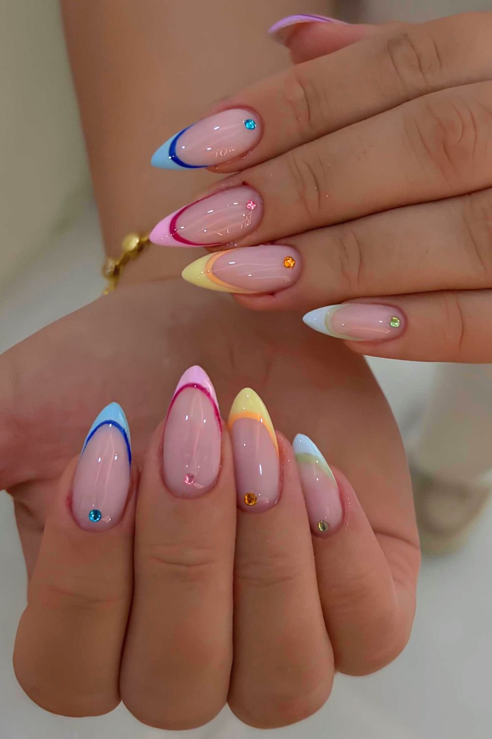 Outlined skittle French nails with gems