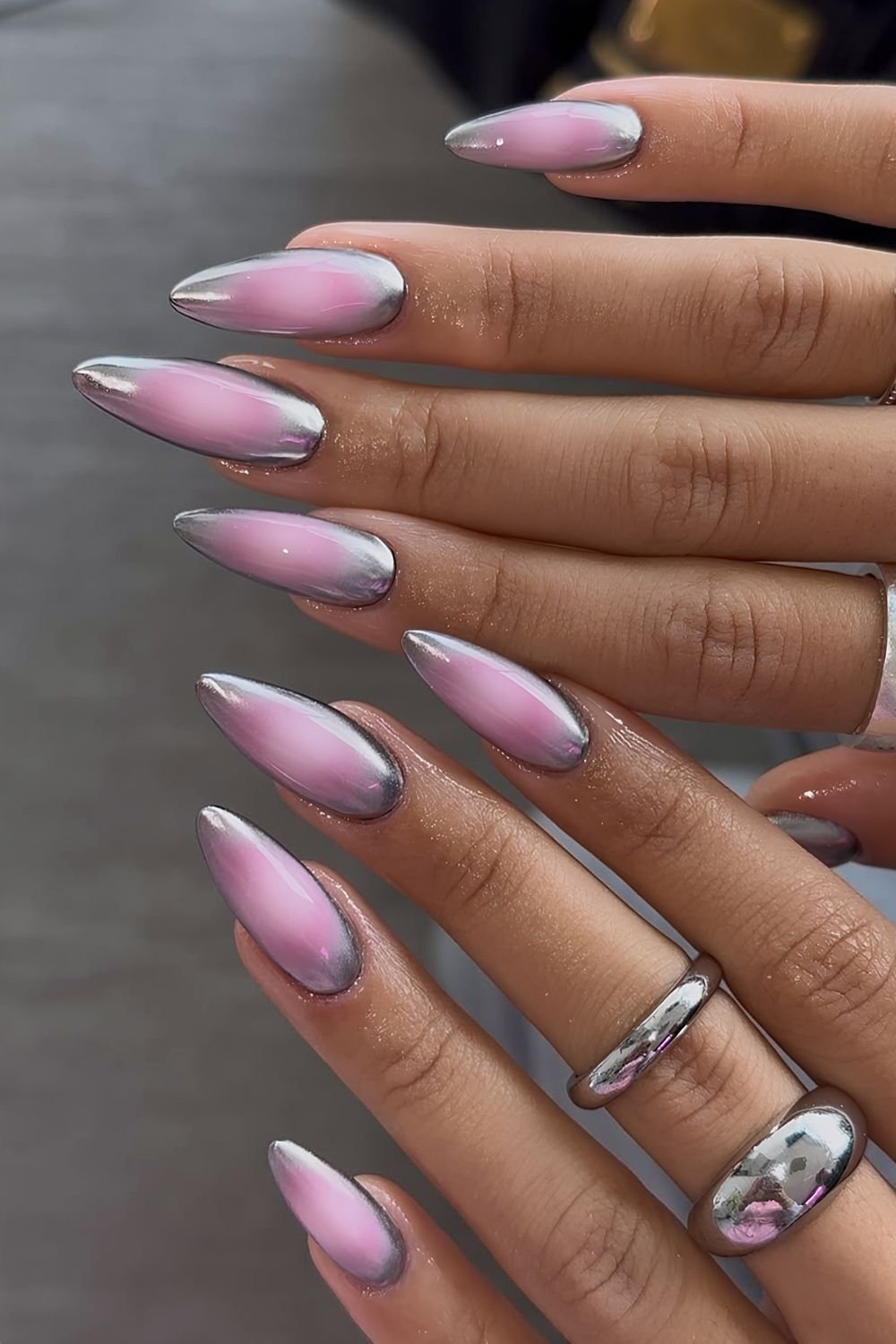 Pink aura nails with silver chrome outline