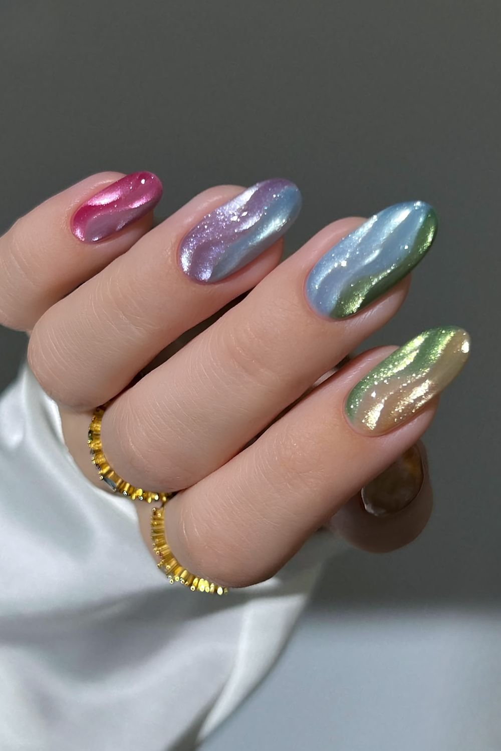 Rainbow cat eye swirl manicure