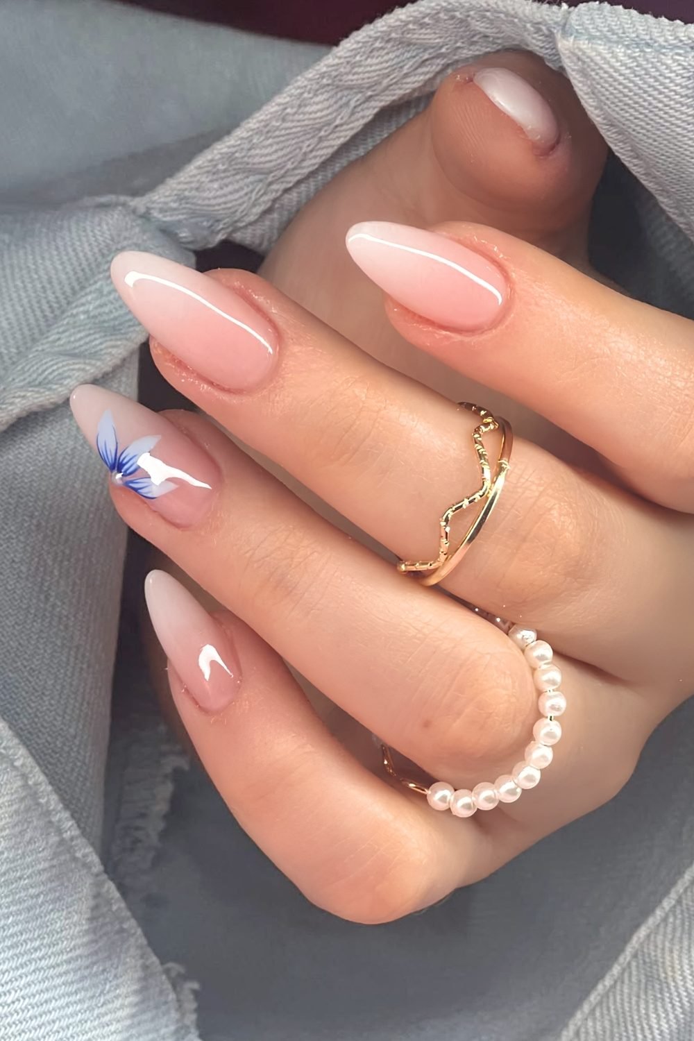 White ombre nails with blue half floral accents