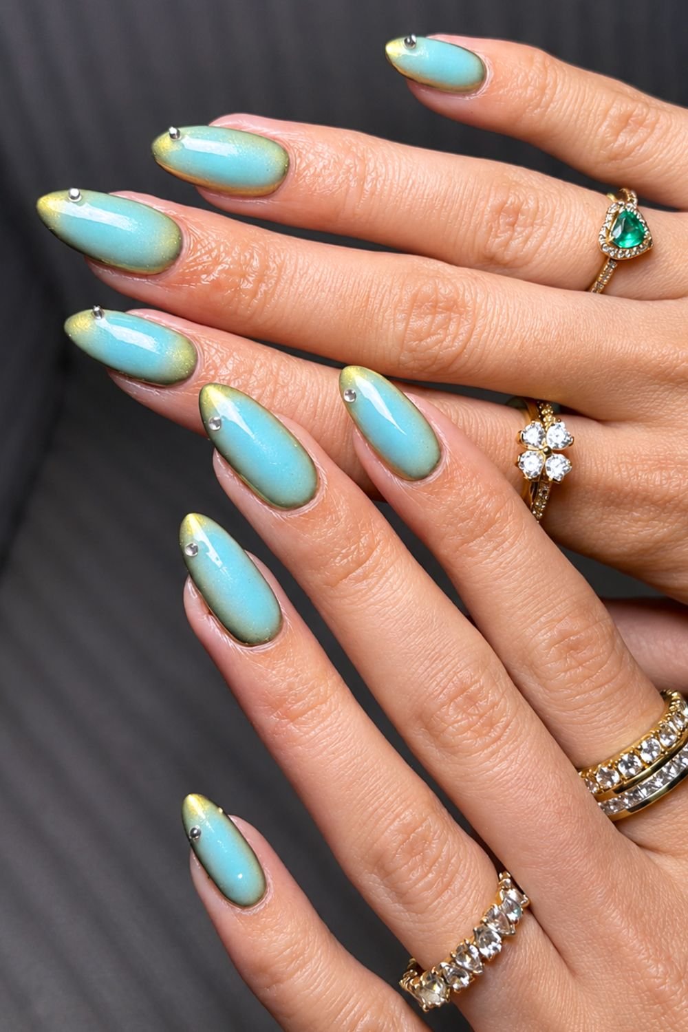 Gold with turquoise chrome aura nails