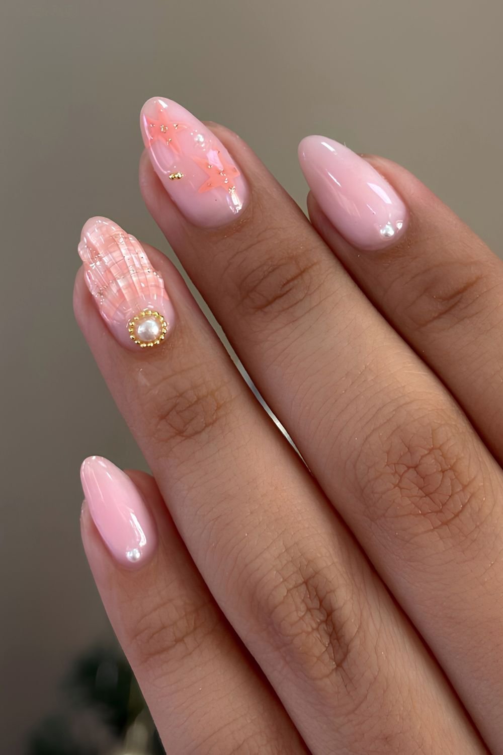Pink and orange seashell nails