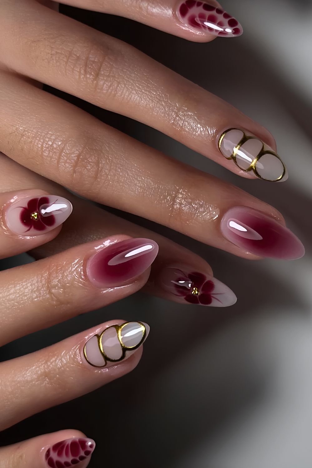Red and gold aura and blooming gel nails