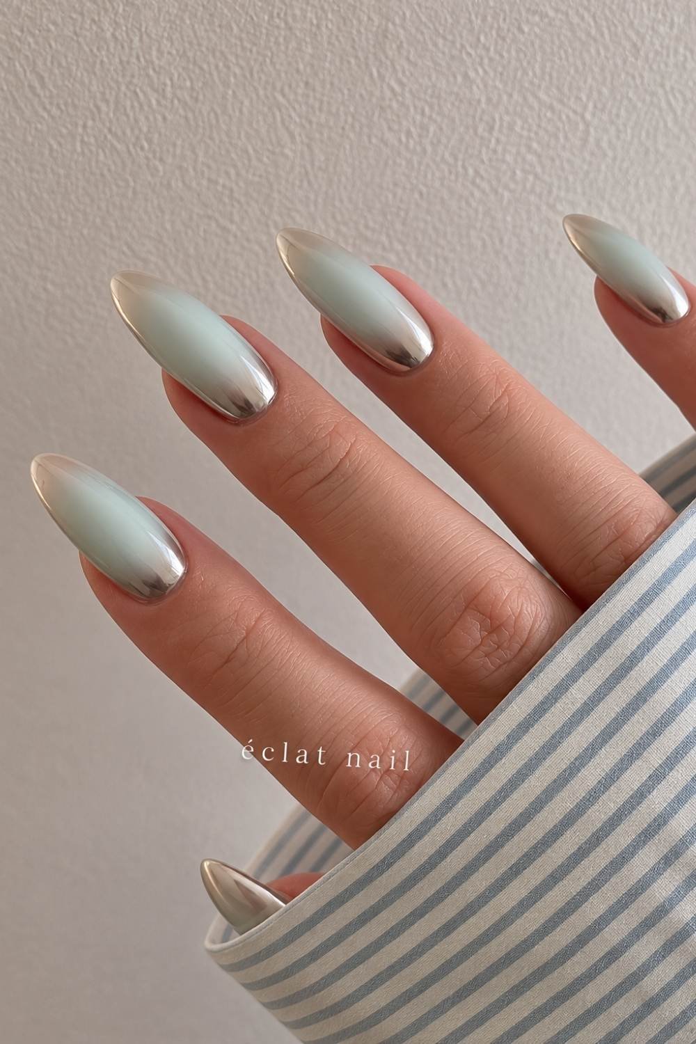 Silver chrome with mint green aura nails