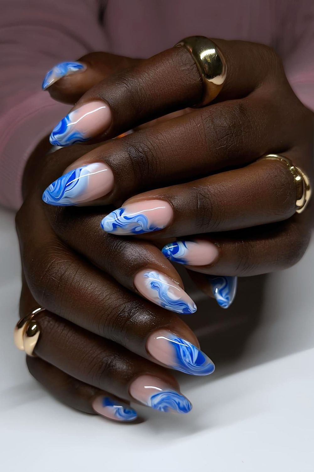 Waves inspired blue marble French nails