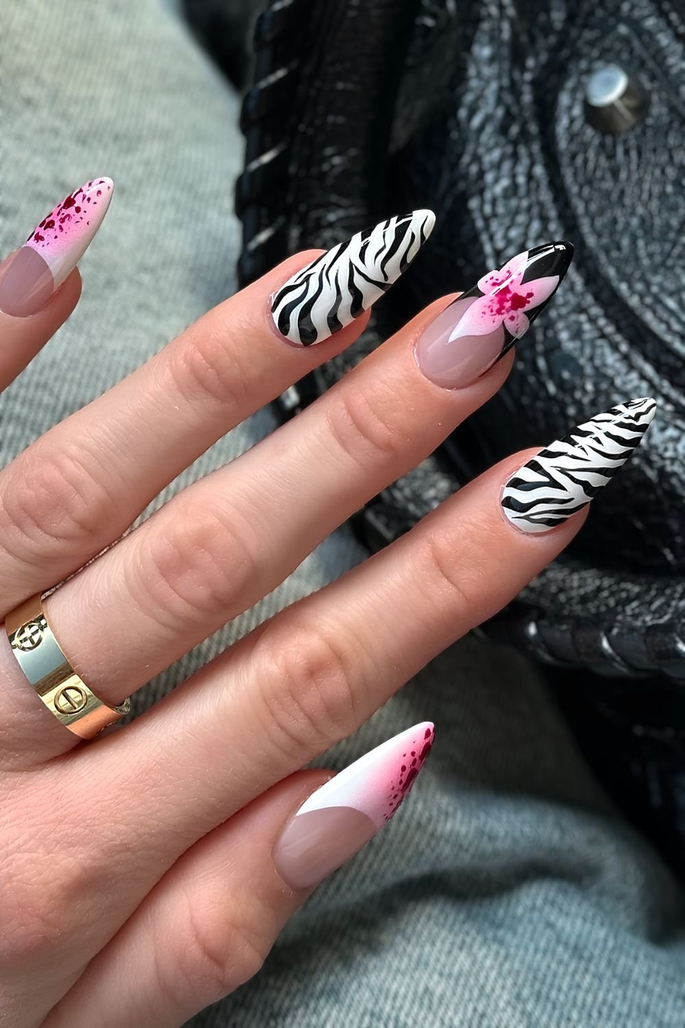 Zebra print stiletto nails with tropical pink floral design