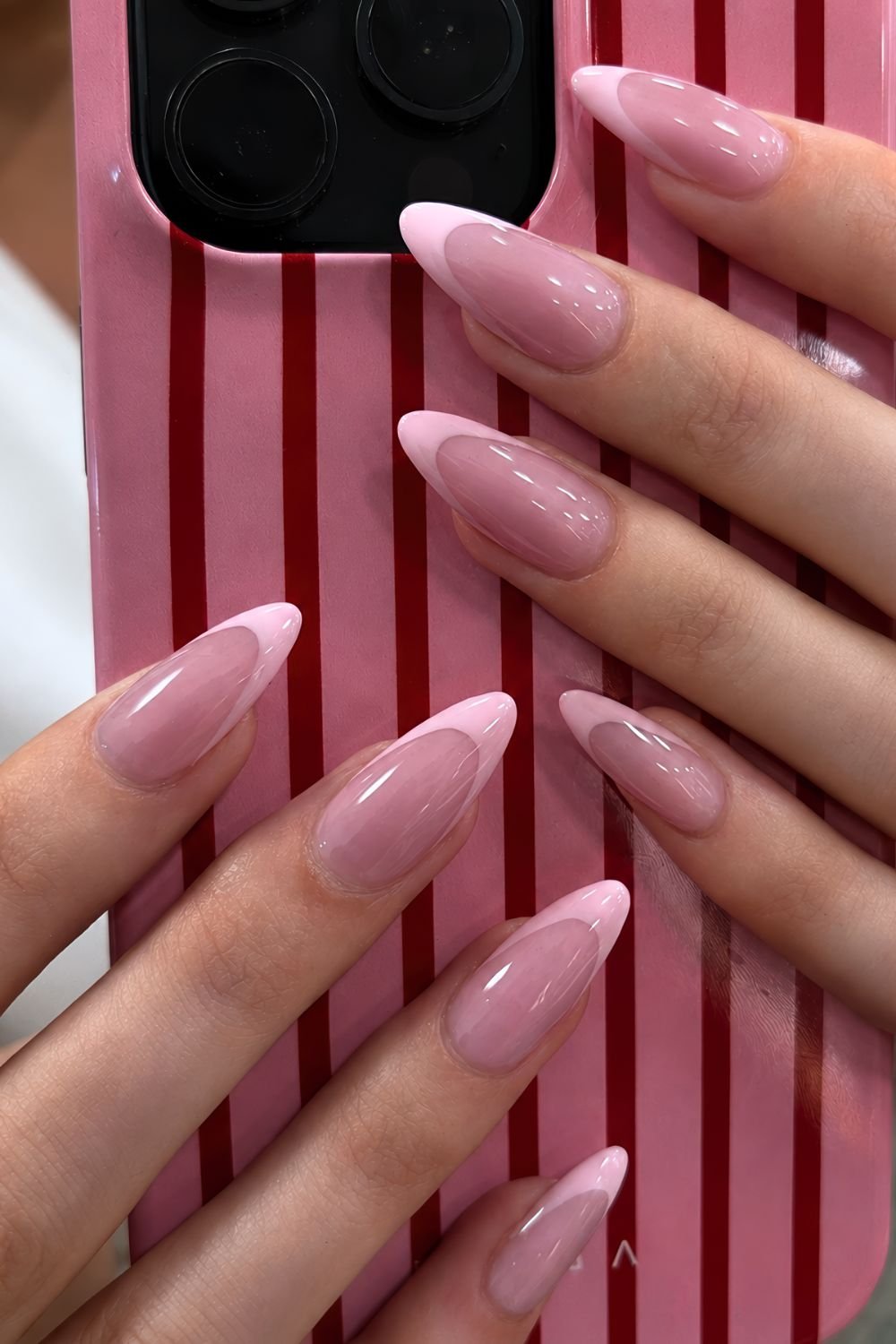 Pink on pink almond shaped French tip nails