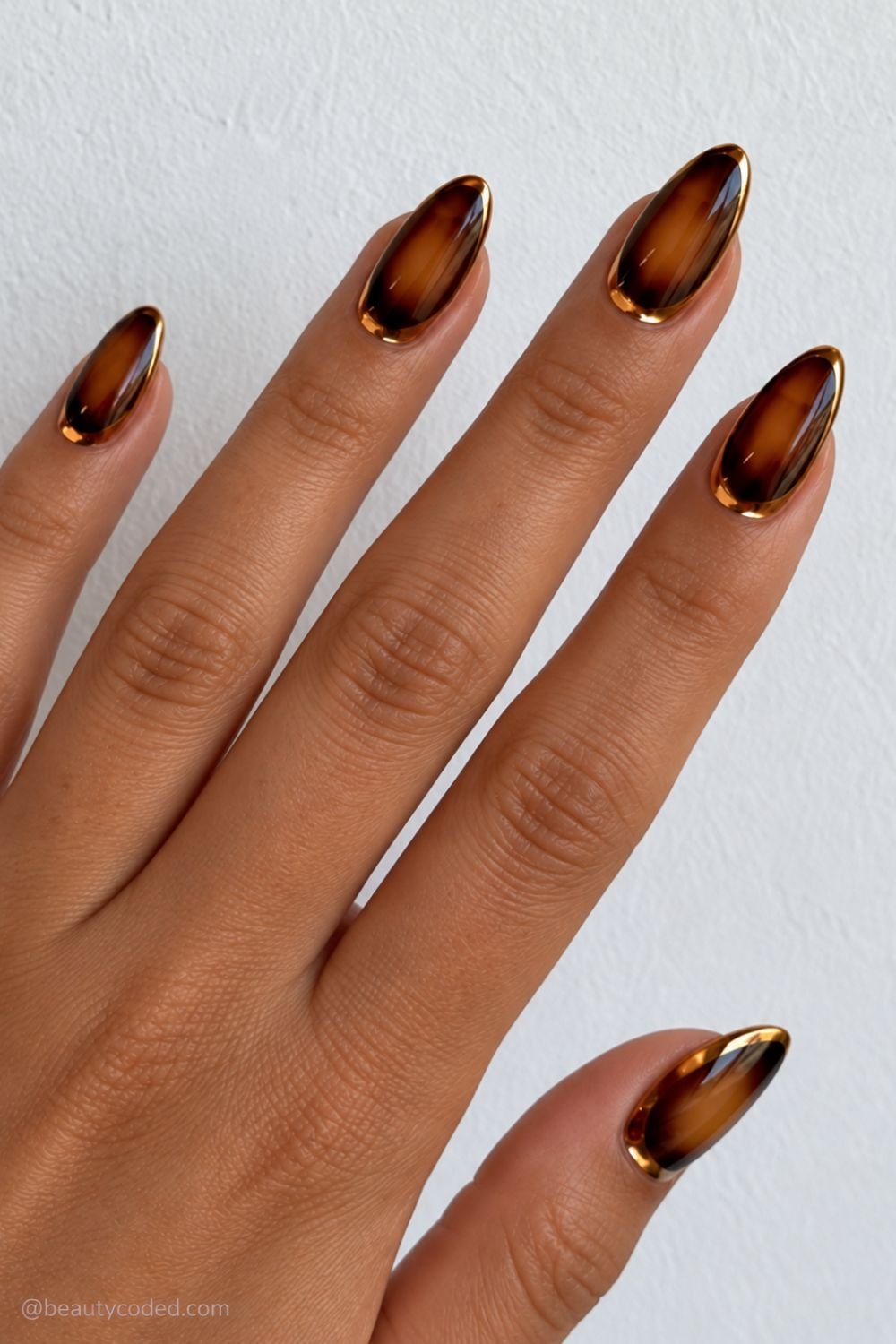 Amber and dark brown gold-edged manicure