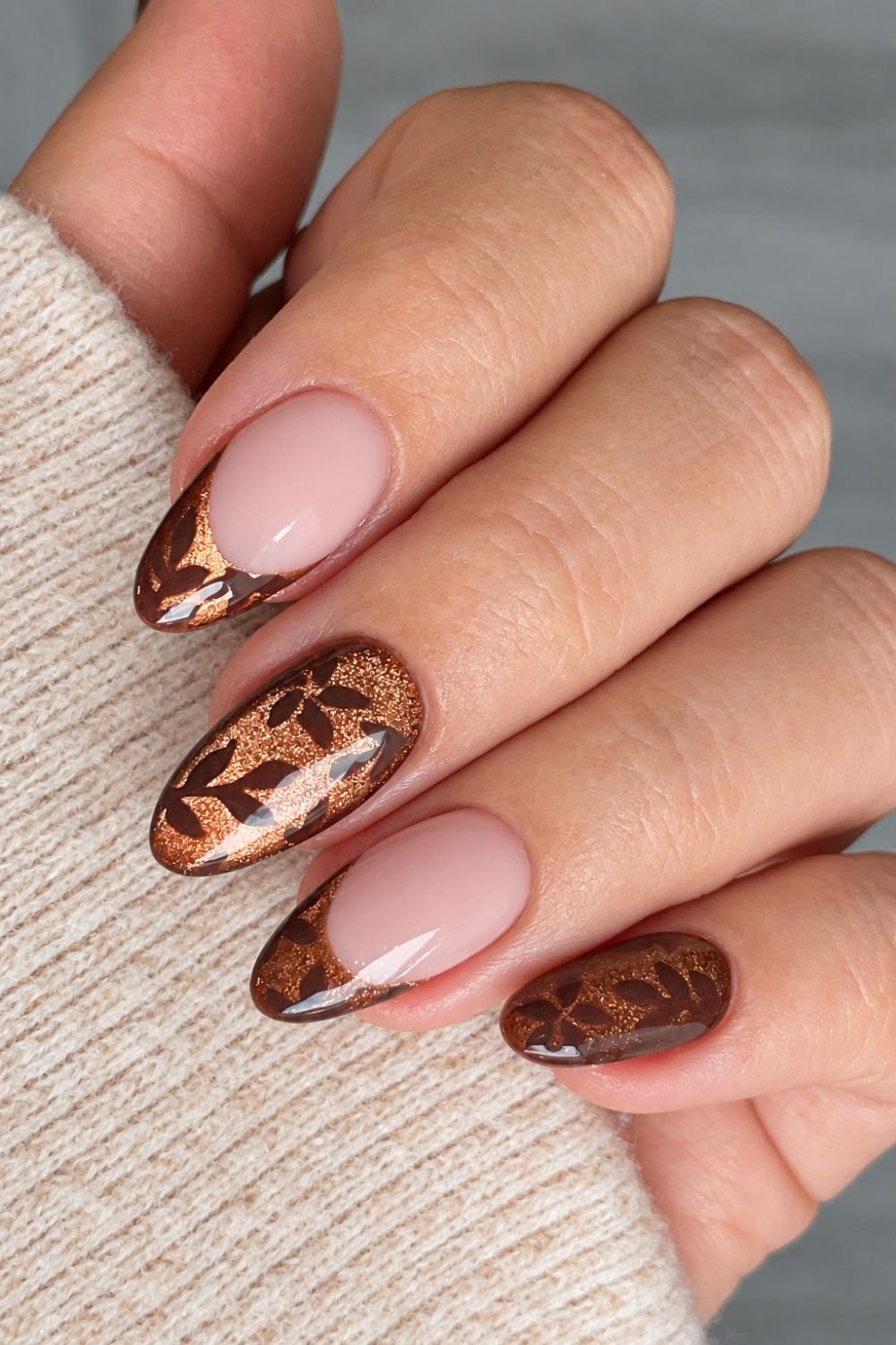 Bronze cat eye nails with dark brown botanical nail art
