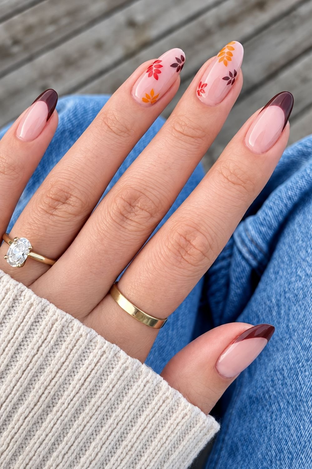 Brown French tip nails with dainity fall leaves design