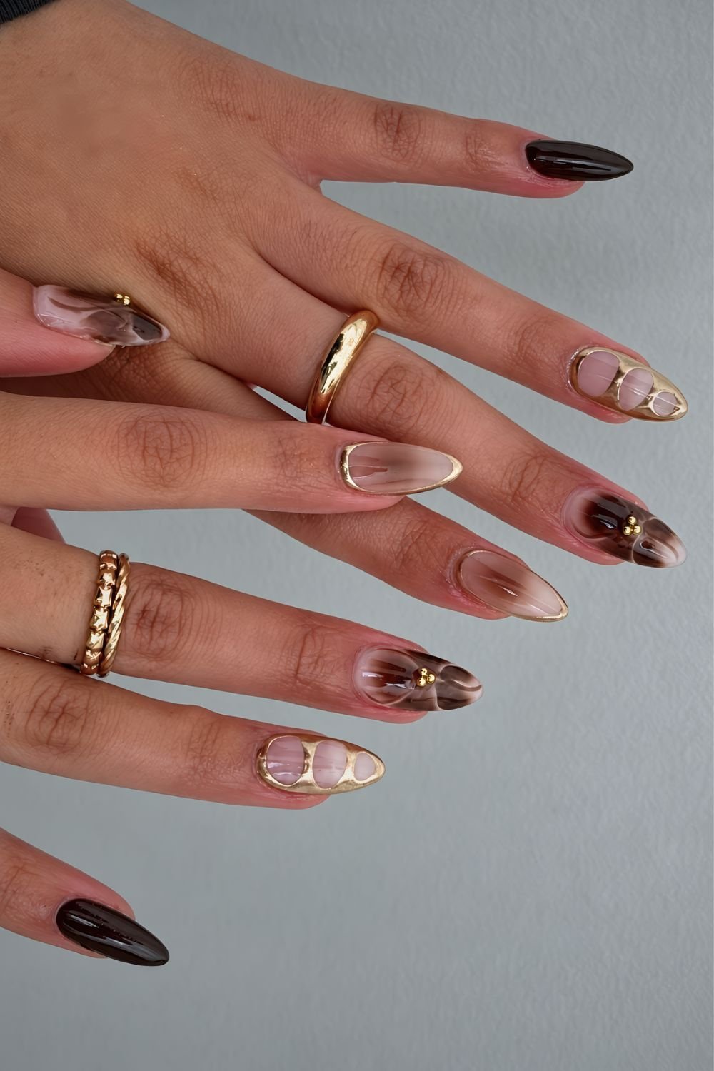 Brown and gold mix and match manicure