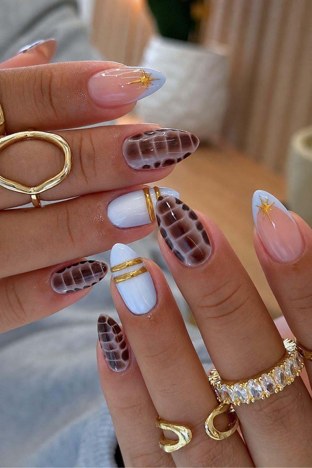 Brown croc print and light blue nails with gold accents