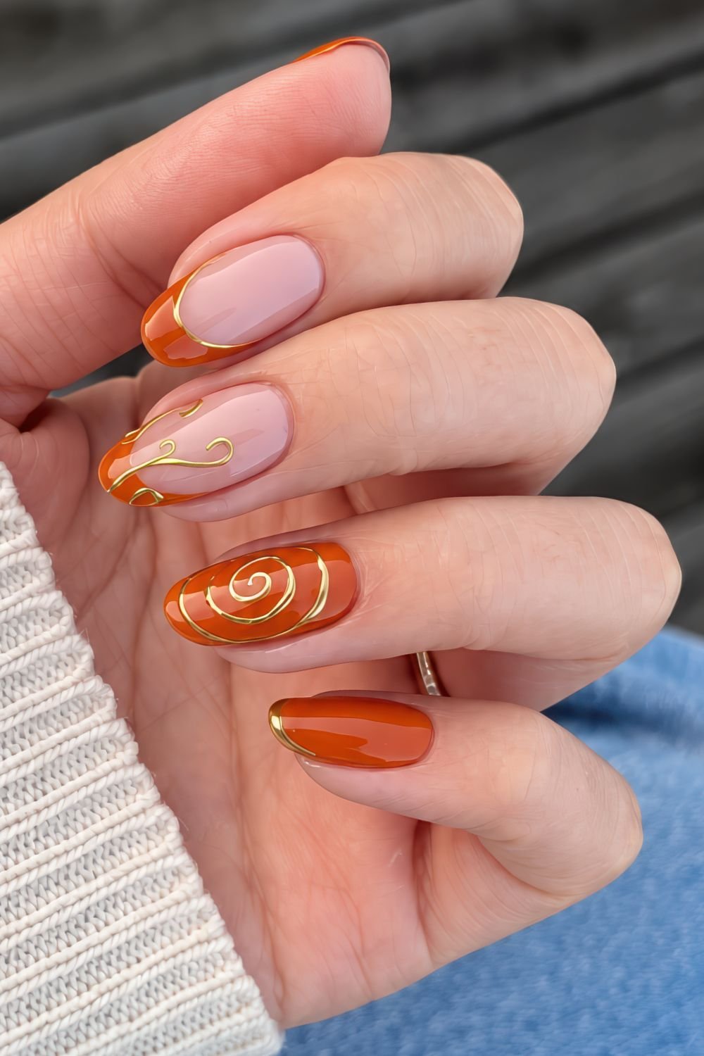 Burnt orange nails with gilded gold chrome accents