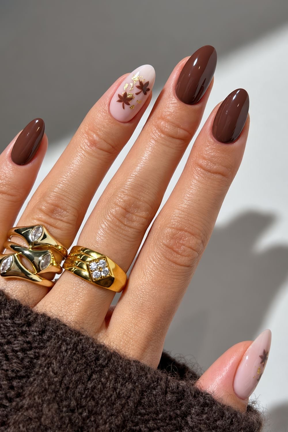 Chocolate brown maple leaaf nails with golden foil