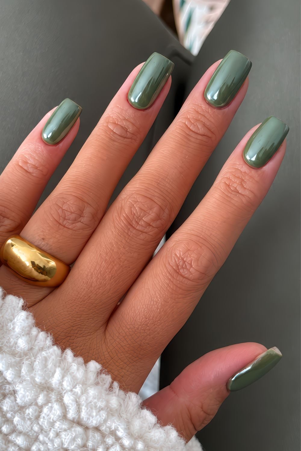 Dark olive green nails with chrome effect