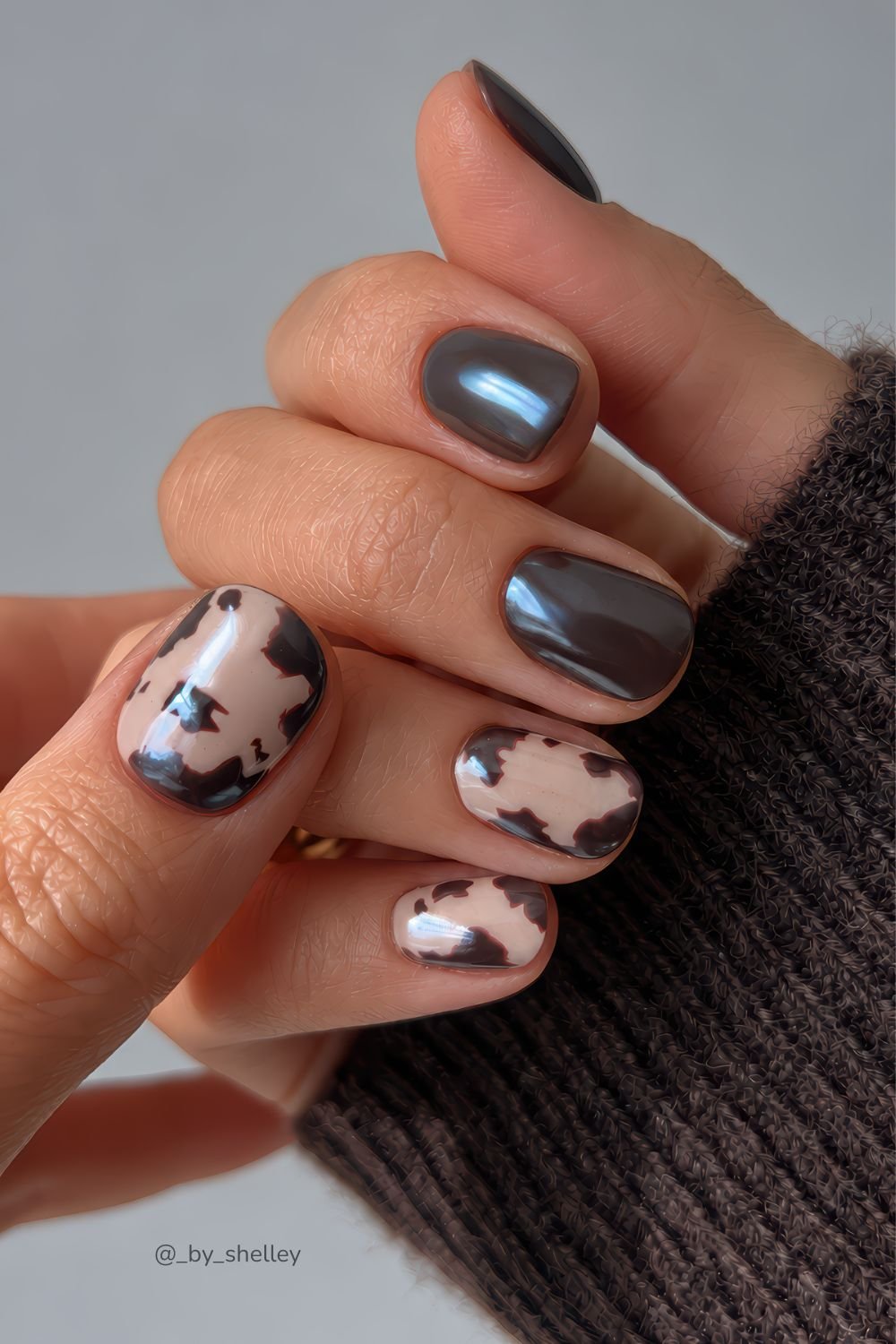Glazed chocoloate brown nails with cow print accent