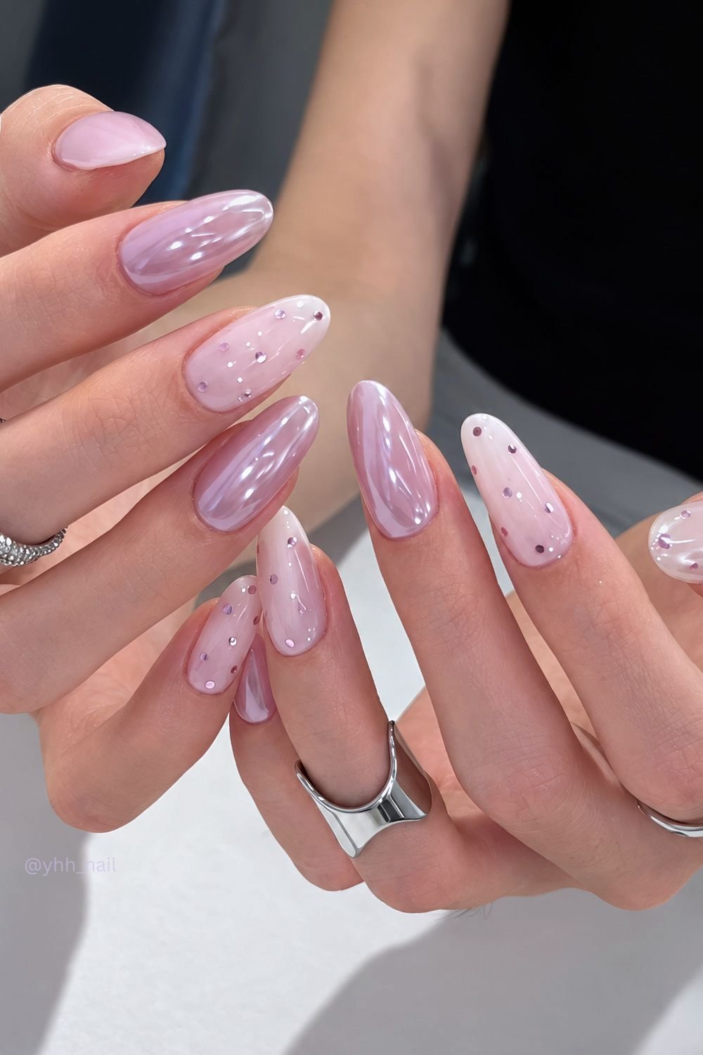 Glazed mauve and milky white nails with glitter polka dots
