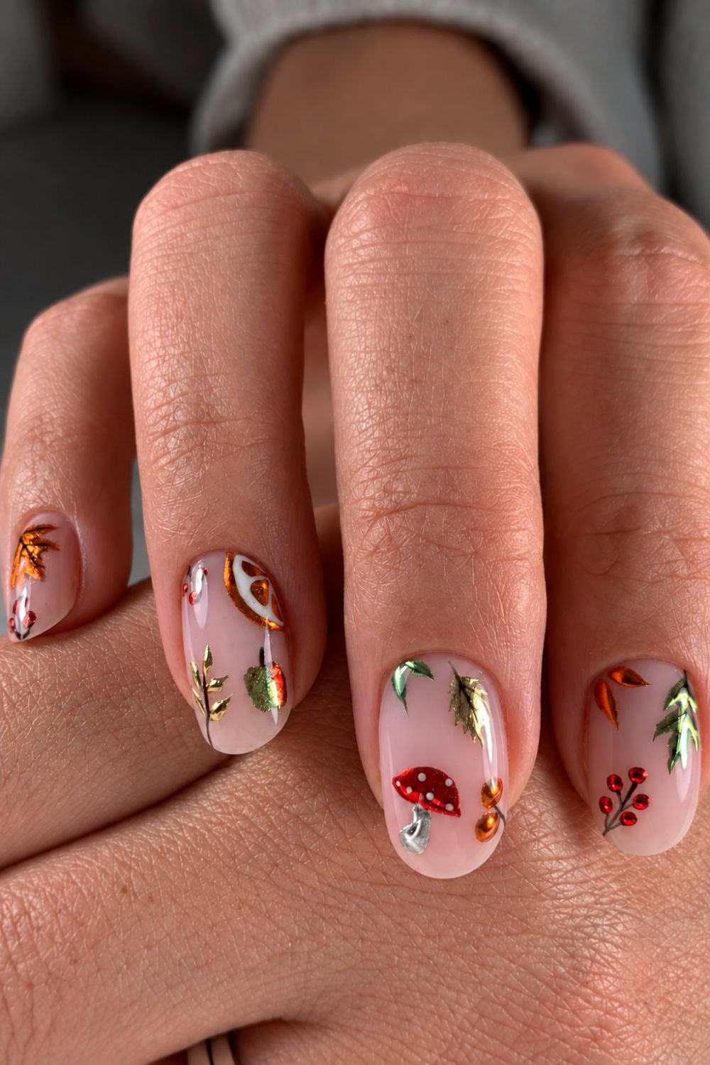 Neutral nails with chrome fall botanicals