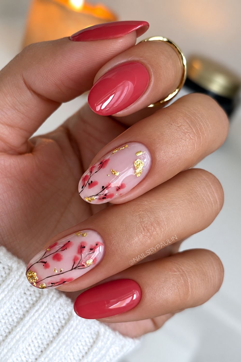 Reddish-wine brown nails with leaf and golden foil design