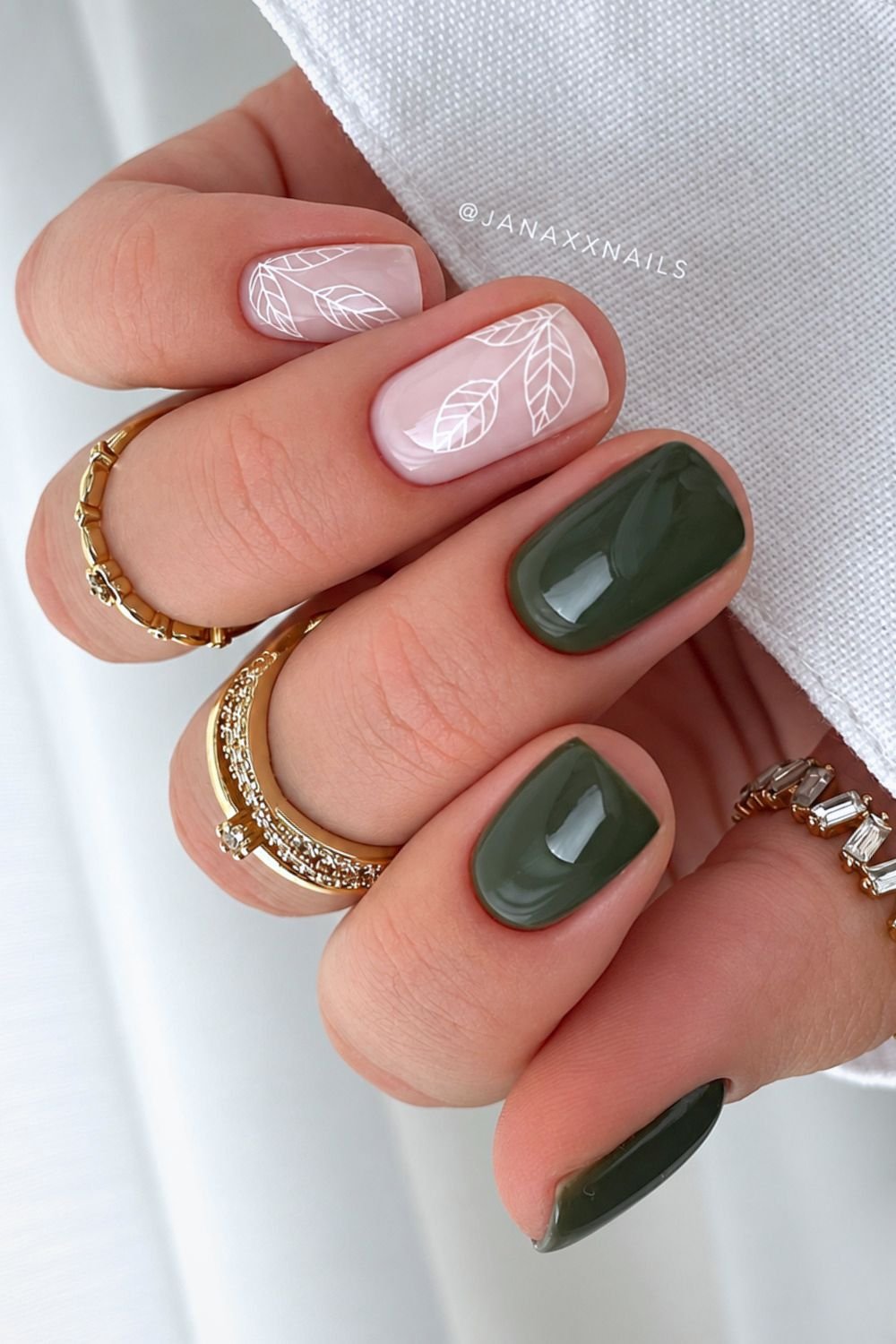 Solid olive green nails with white on white leaf design accents